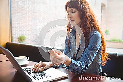 Student using laptop in cafe to shop online Stock Photo