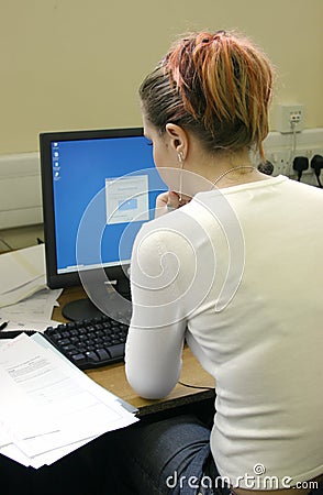 Student working at computer and VDU Stock Photo