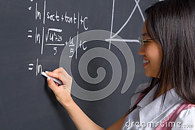 Student working on mathematics problem Stock Photo