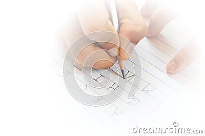 Student writing alphabet Stock Photo