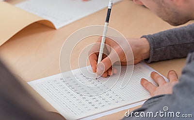 Student writing Chinese characters Stock Photo