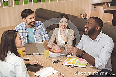 Students in the cafe study together education concept Stock Photo