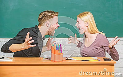 Students communicate classroom chalkboard background. Violence and bullying. Communication between group mates Stock Photo