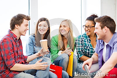 Students communicating and laughing at school Stock Photo