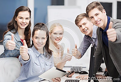 Students with computer monitor and tablet pc Stock Photo