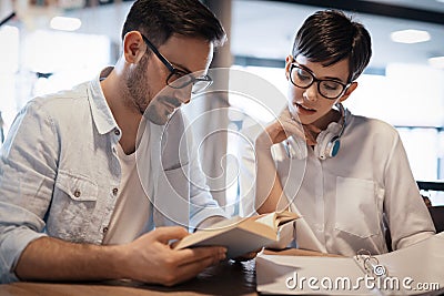 Students couple in school studying for exams together Stock Photo