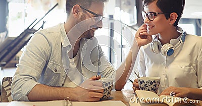 Students couple in school studying for exams together Stock Photo