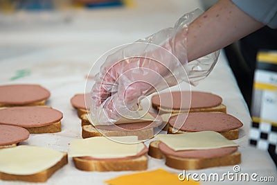 Students of coworkers making food for charity or homeless people Stock Photo