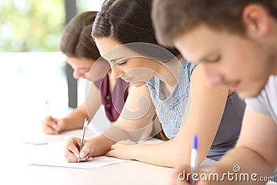 Students doing an exam in a classroom Stock Photo