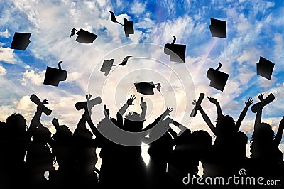 Students graduate cap throwing in sky Stock Photo