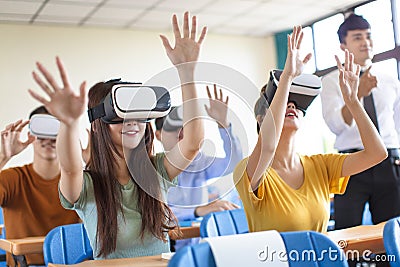 Students having fun with new technology vr headset in classroom Stock Photo