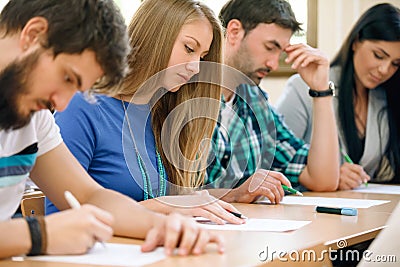 Students having a test in a classroom Stock Photo