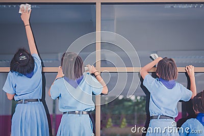 Students are helping to wipe the glass. Editorial Stock Photo