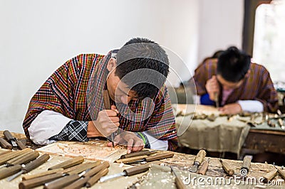 Students learning wood carving at art school Editorial Stock Photo