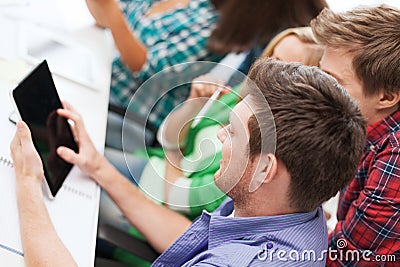 Students looking at tablet pc at school Stock Photo