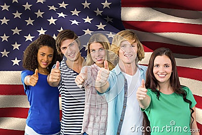 students making thumbs up against American flag background Stock Photo