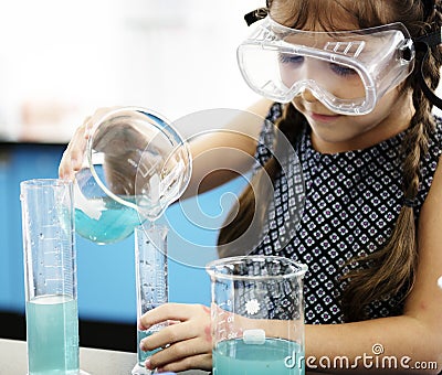 Students Mixing Solution in Science Experiment class Stock Photo