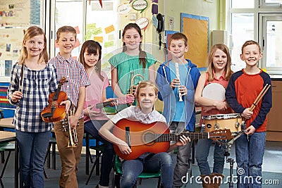 Students Playing In School Orchestra Together Stock Photo