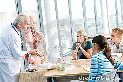 Students with professor and human anatomical model Stock Photo