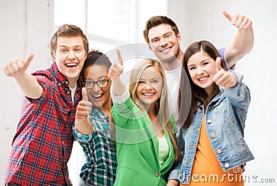 Students showing thumbs up at school Stock Photo