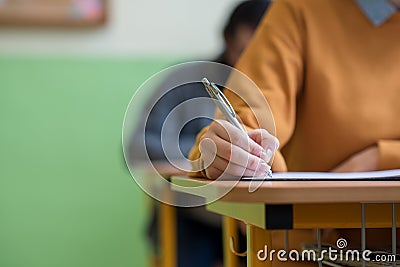 Students taking exam in classroom. Education test. Stock Photo