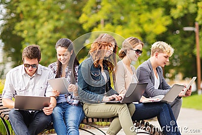 Students or teenagers with laptop computers Stock Photo