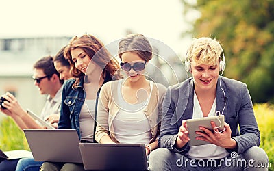 Students or teenagers with laptop computers Stock Photo