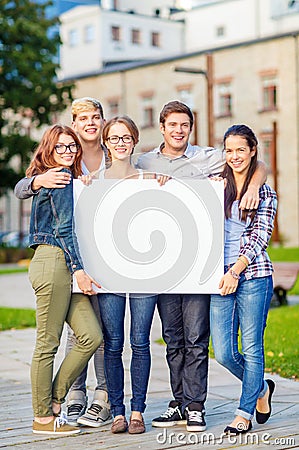 Students or teenagers with white blank board Stock Photo