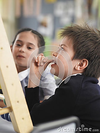 Students Using Abacus In Classroom Stock Photo