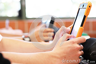 Students using digital technology in the classroom. Stock Photo