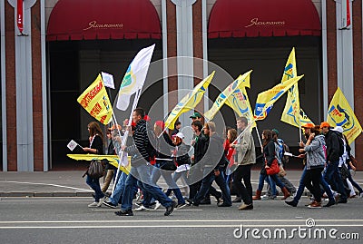 Students walk holding yellow flags. Editorial Stock Photo