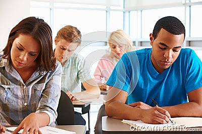 Students working in classroom Stock Photo