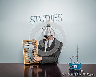 Studies text on blackboard with businessman Stock Photo