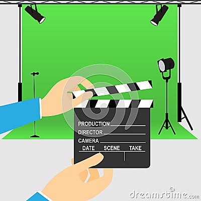 Hands holding a clapperboard in front of a movie studio Stock Photo