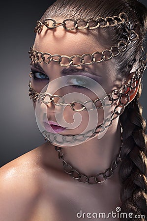 Studio beauty portrait in chains Stock Photo