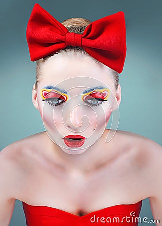 Studio beauty portrait of doll with red bow Stock Photo