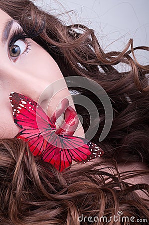 Studio beauty portrait with red butterfly Stock Photo