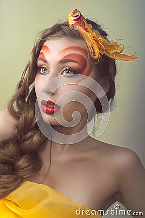 Studio beauty portrait with yellow bird Stock Photo