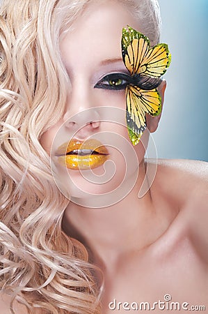 Studio beauty portrait with yellow butterfly Stock Photo