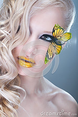 Studio beauty portrait with yellow butterfly Stock Photo