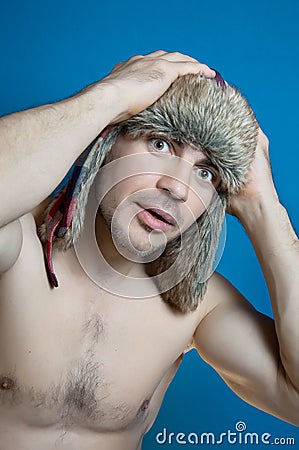 Studio closeup colorful portrait of face young glamour sportive hipster man in stylish fur hat with crazy emotions surprise Stock Photo