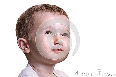 Studio closeup portrait of little baby boy looking full of expectations to the right, isolated on white background Stock Photo