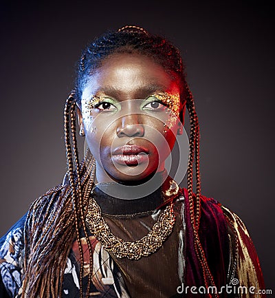 Studio fashion portrait of young African ethnicity woman with shiny make up Stock Photo