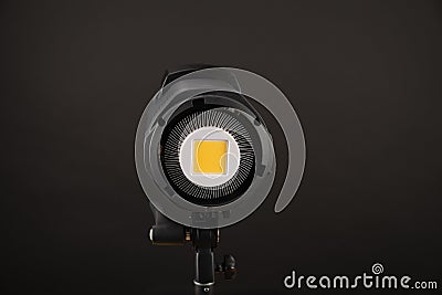 Studio light flash lamp closeup on black background Stock Photo