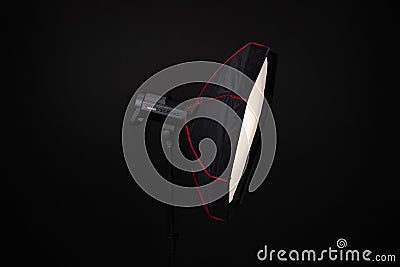 Studio lighting equipment icon, on black background. A stylish strip softbox for a photo studio. Studio light on stand. Jinbei Editorial Stock Photo