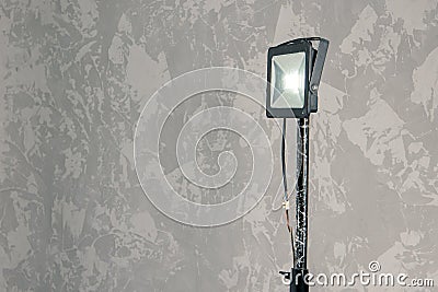 Studio lighting rustic lamp hand made illumination object inside room with design painted wall background, empty copy space Stock Photo
