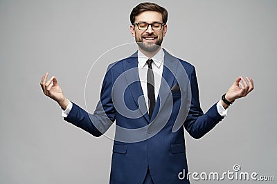 Studio photo of meditative young handsome stylish businessman wearing suit Stock Photo