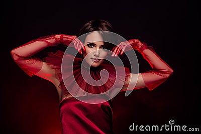 Studio photo stunning woman wear masquerade costume casino night touch her face silky gloves cloth posing camera Stock Photo