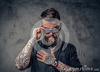 A man with tatoos on his arms. Stock Photo