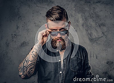 A man with tatoos on his arms. Stock Photo